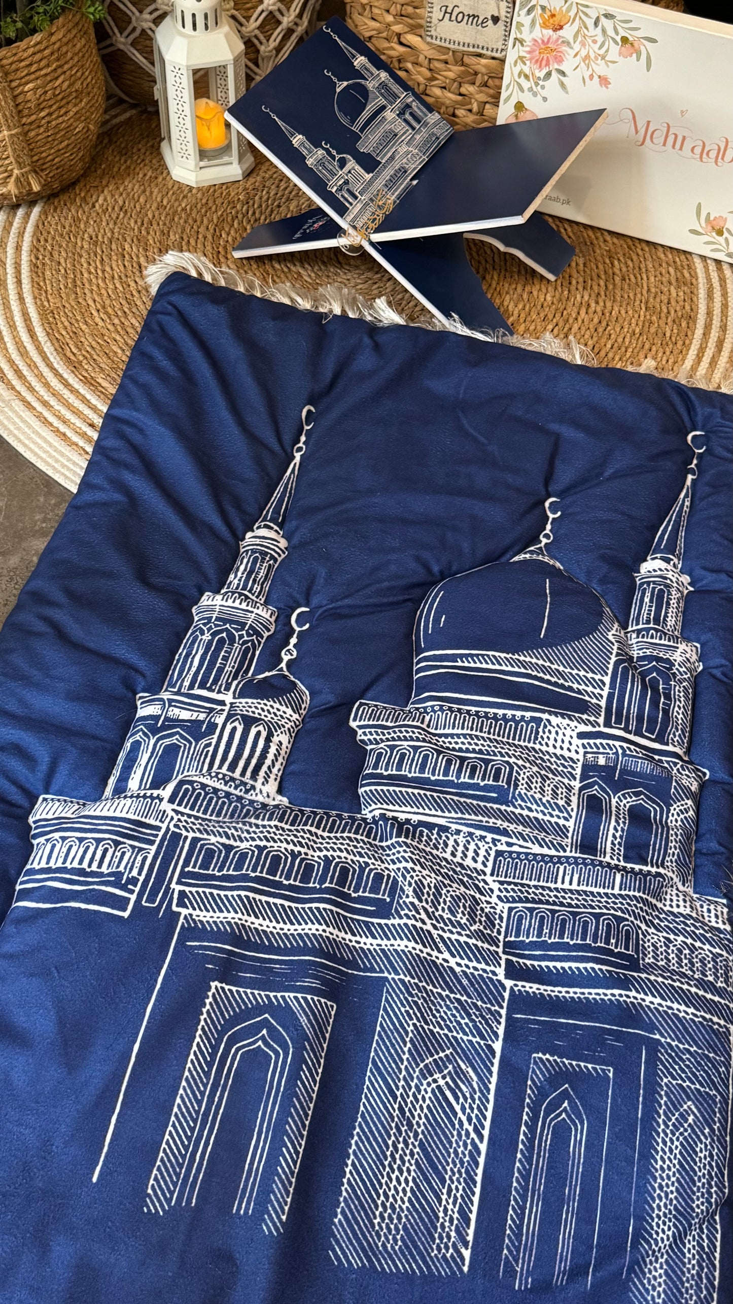 Ad08:Blue prayer mat with outline of mosque