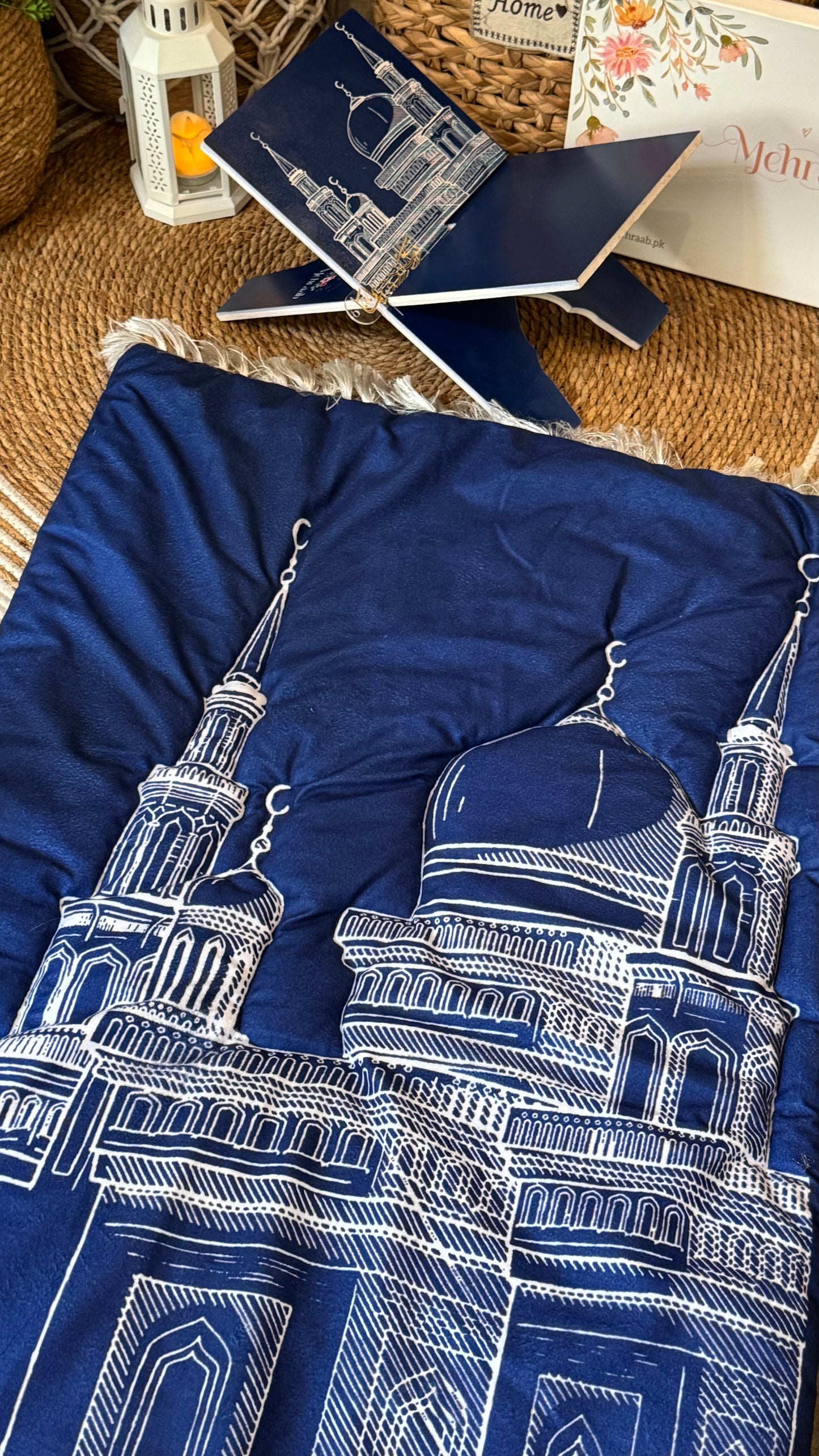Ad08:Blue prayer mat with outline of mosque