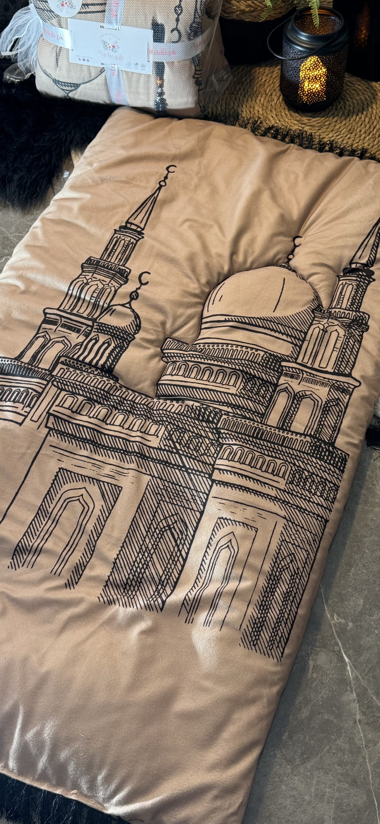 Ad:09Beige prayer mat with mosque outline.