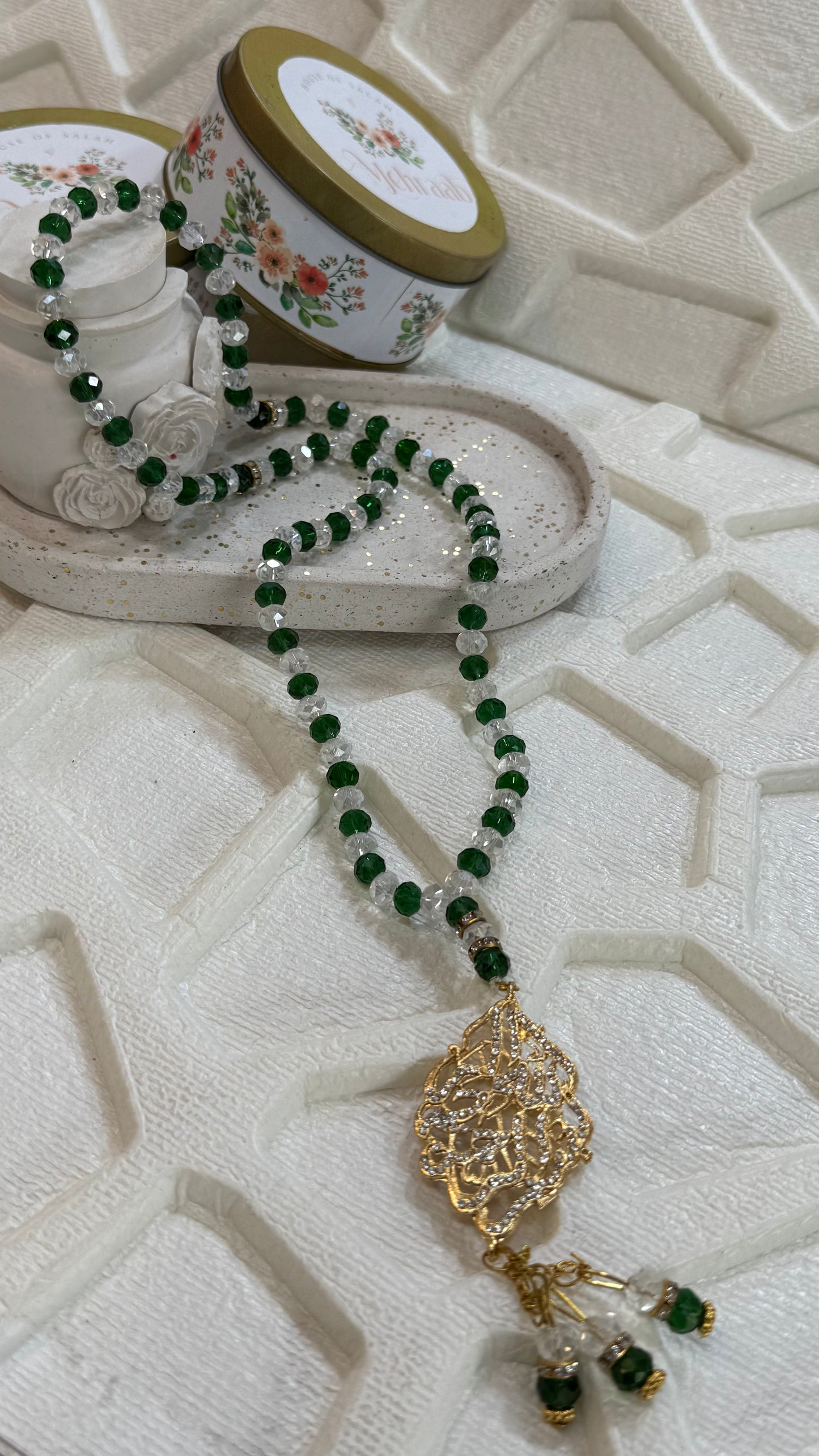 Green and white tasbeeh.