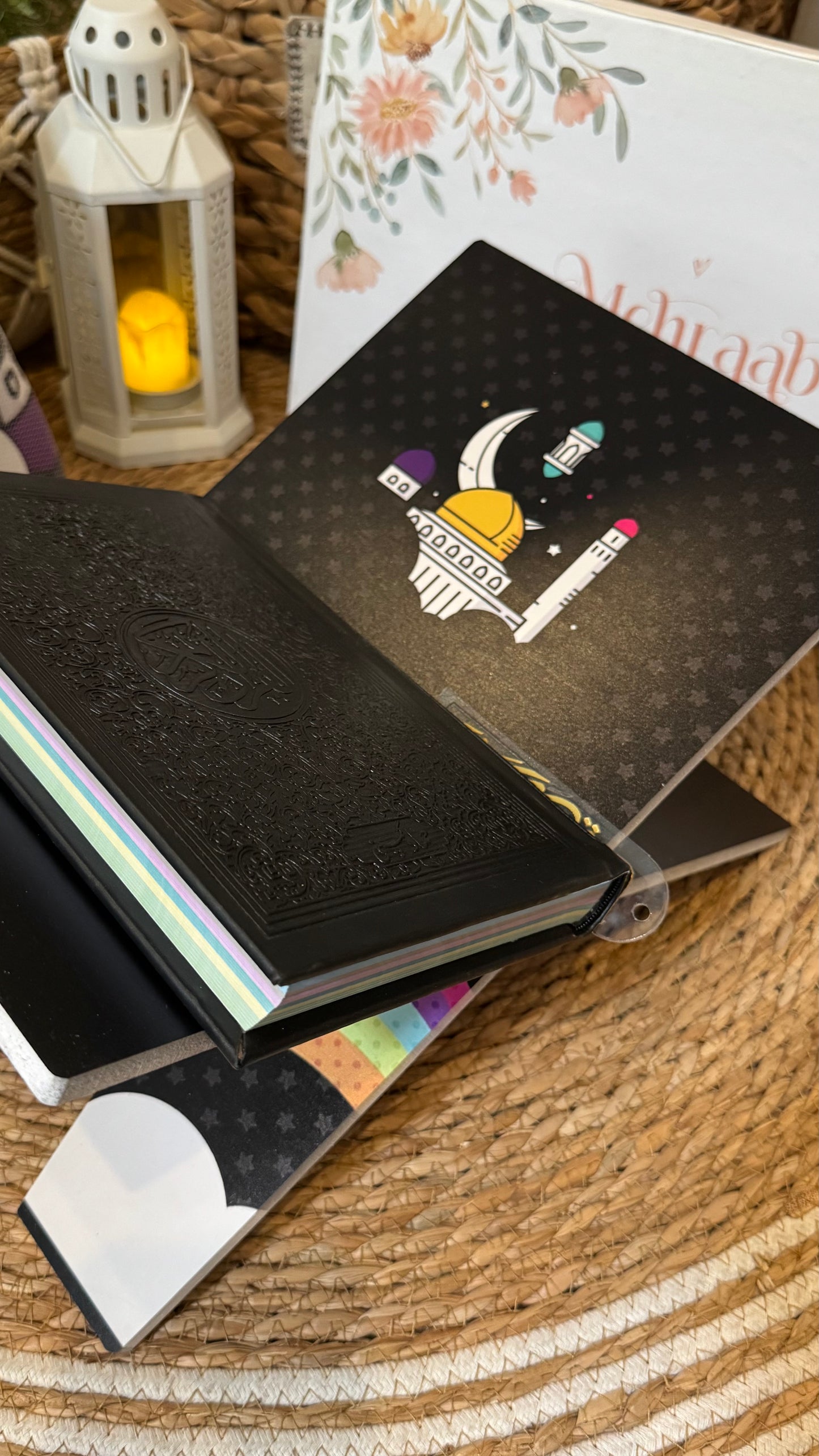 Rk07:Black Rehal with illustration of rainbow and clouds.