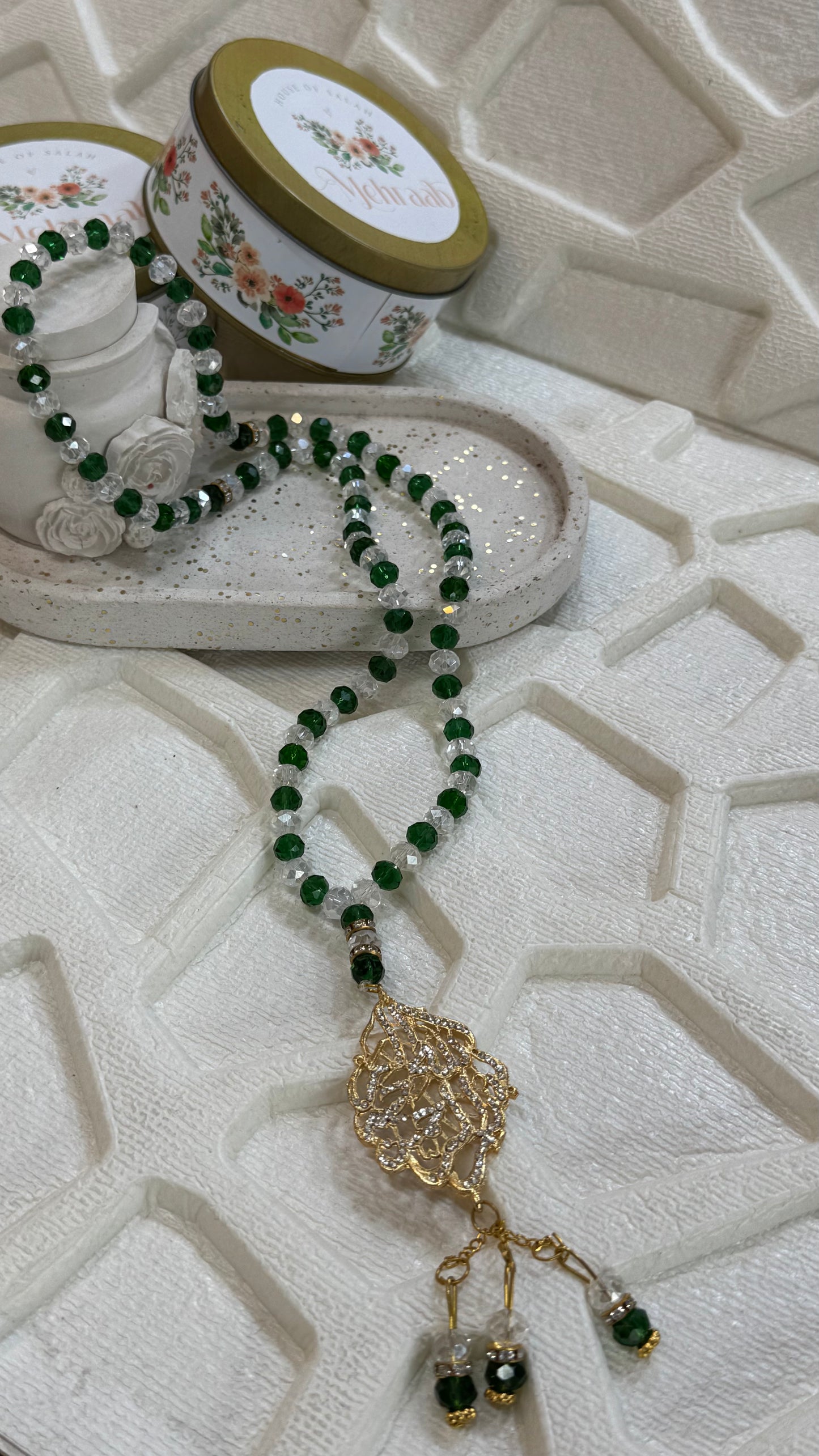 Green and white tasbeeh.
