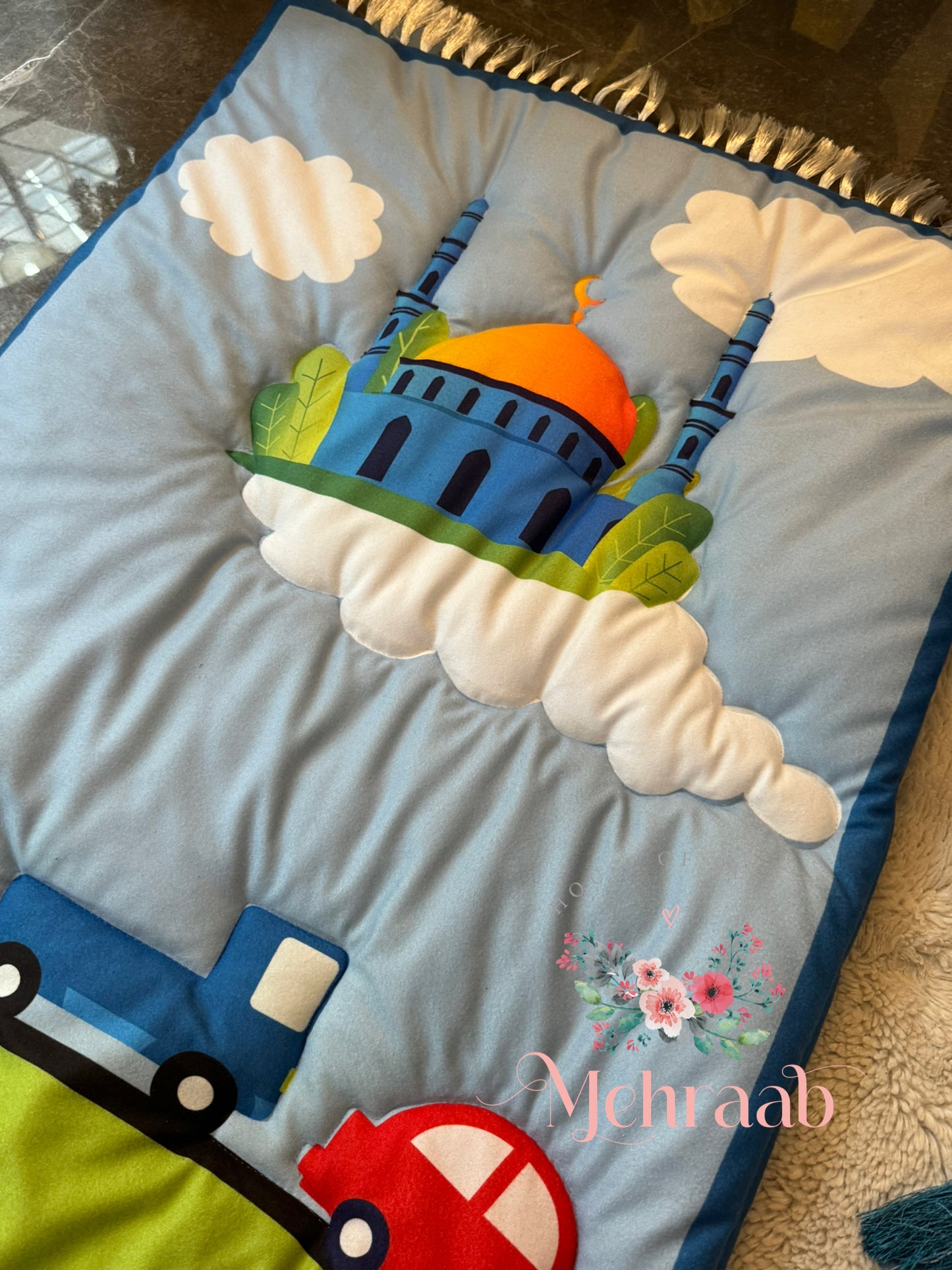 K08:Sky blue prayer mat with colorful cars and a mosque on clouds