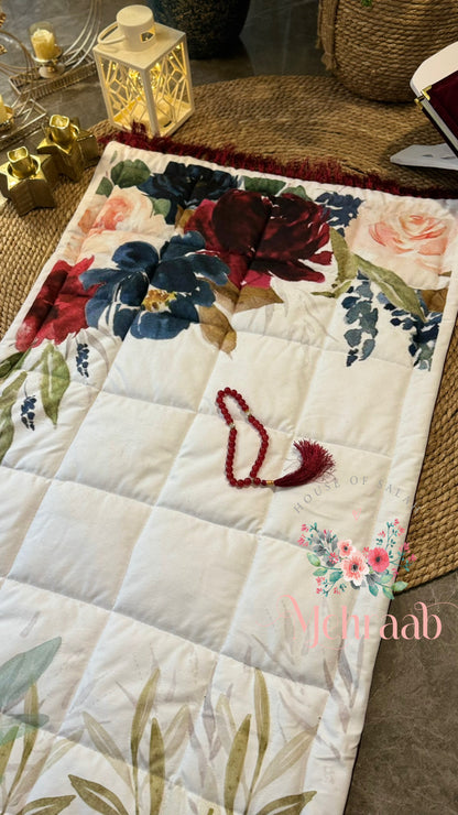 Colorful flowers on white prayer mat